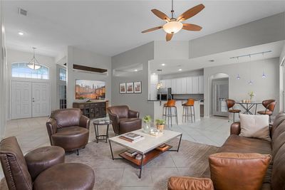 family room + breakfast bar + eat at area virtual staged | Image 3