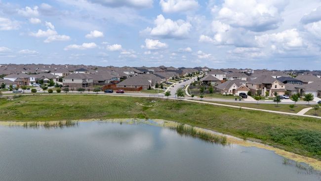 Aerial view of residential area featuring a nearby body of water | Image 33