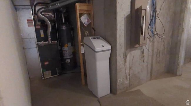 Utilities featuring gas water heater | Image 64