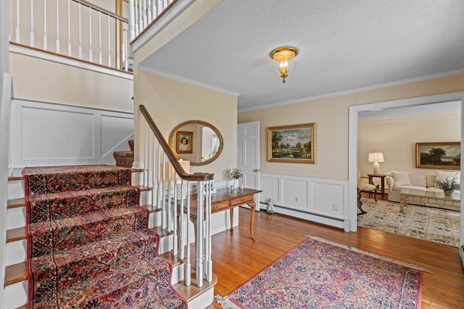 Flanked by formal living and dining rooms with custom millwork throughout | Image 7