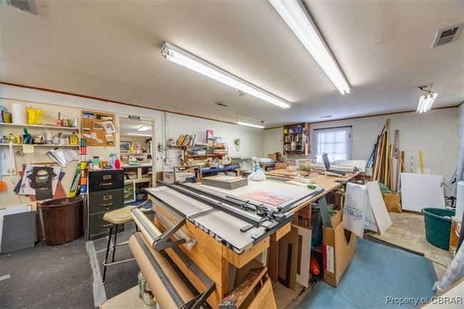 Miscellaneous room featuring a workshop area | Image 14