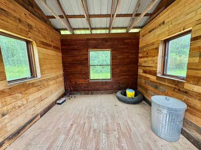 unfurnished room featuring wooden walls and wood finished floors | Image 34