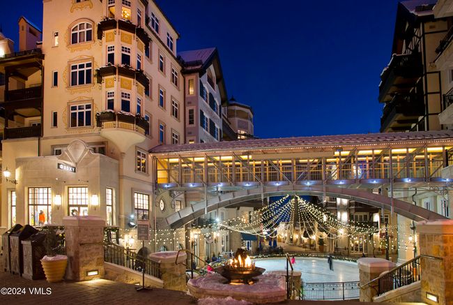 The iconic Arrabelle ice rink glows with winter magic—just outside your door. Cozy up by the firepit after a day on the slopes, or take in the alpine energy from your private balcony above it all. | Image 25