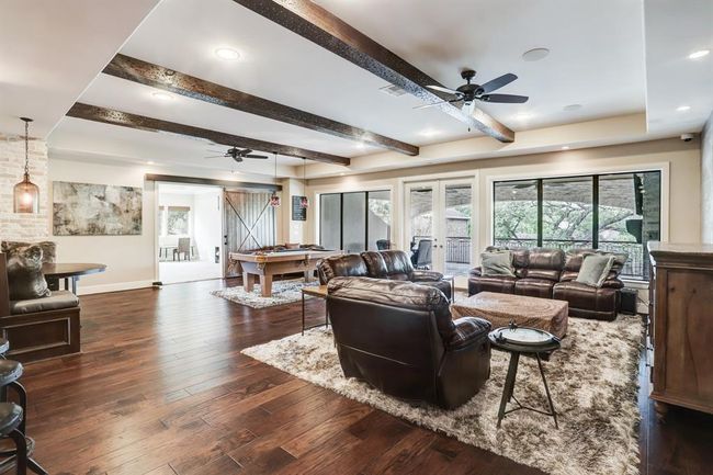 Sliding doors lead to the playroom. | Image 34