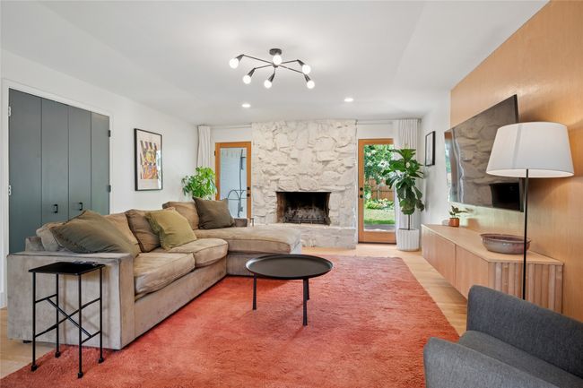 Rear living room with wet bar and fireplace. | Image 8