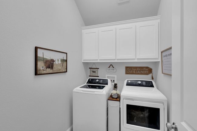 Laundry room with independent washer and dryer and cabinet space | Image 30