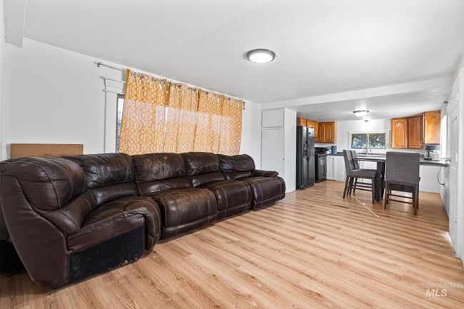 Living area with light wood-type flooring | Image 5