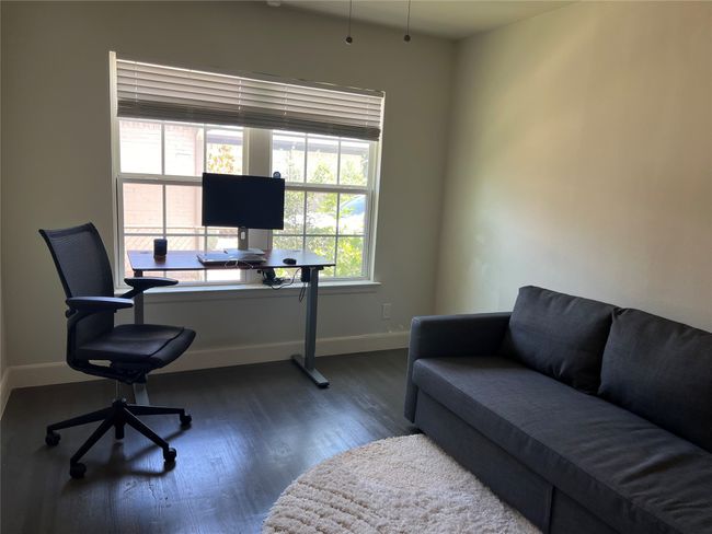 Guest bedroom 3 with laminate wood floors used as an office | Image 20