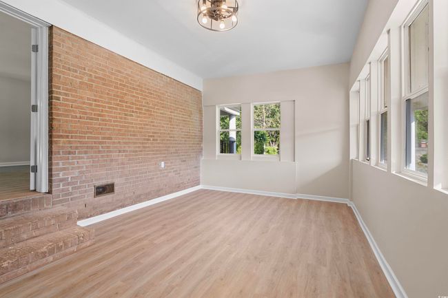 Unfurnished sunroom with a chandelier | Image 12