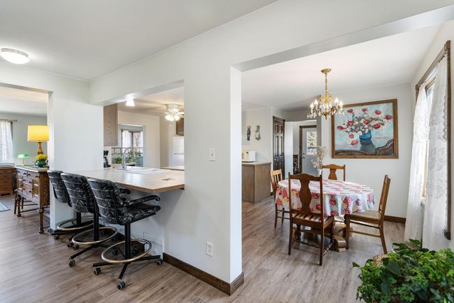 There is a nice breakfast bar as well as an informal dining space adjacent to the kitchen | Image 15