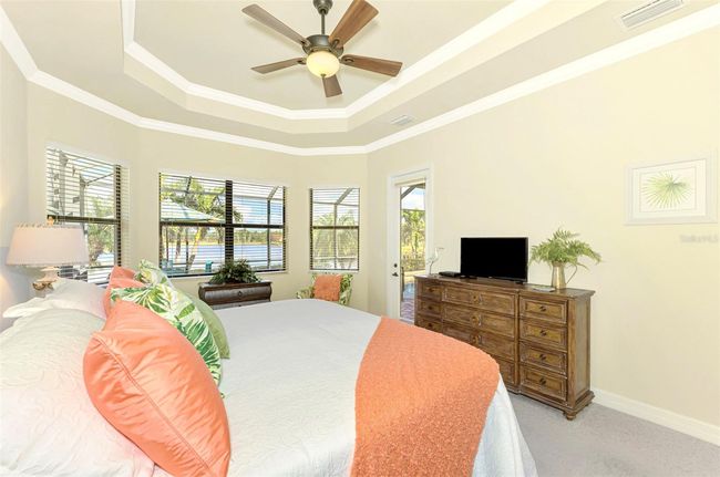 Spacious Primary Suite with w/Tray Ceiling & Crown Molding | Image 39