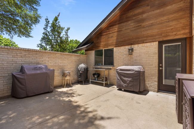 View of side patio off of the kitchen featuring grilling area | Image 10