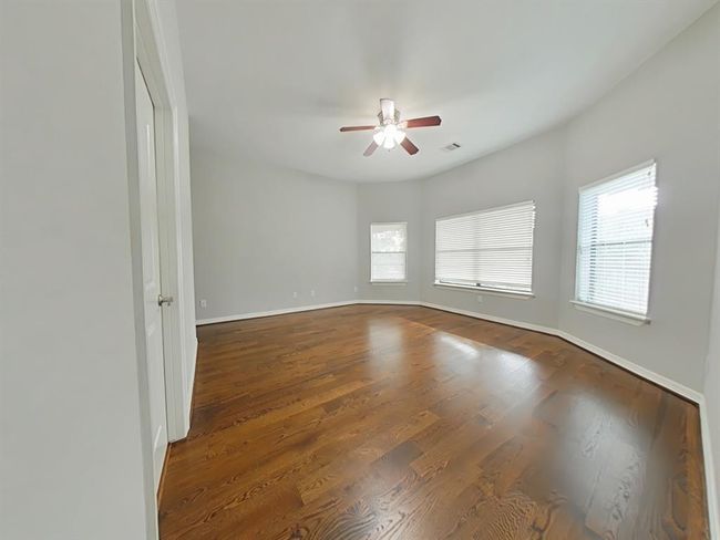 Upstairs secondary bedroom with private ensuite bath. | Image 29