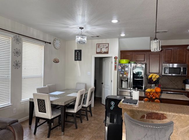 View of dining area with kcozy kitechn. | Image 17