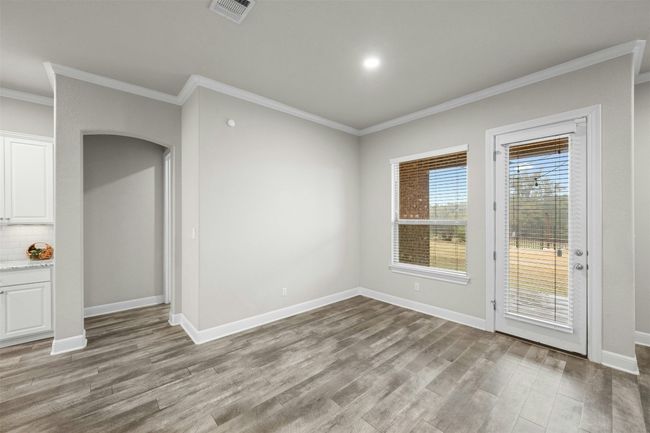 A bright eat-in area provides the perfect spot for casual dining with family and friends. | Image 16