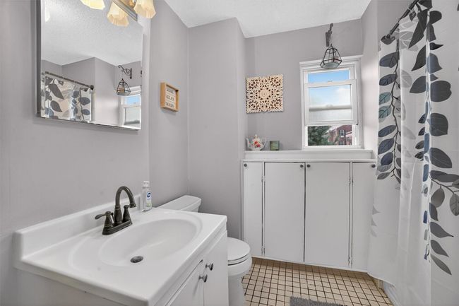 Bathroom featuring vanity, tile patterned floors, and a textured ceiling | Image 18