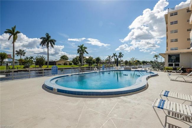 View of swimming pool with a patio | Image 29
