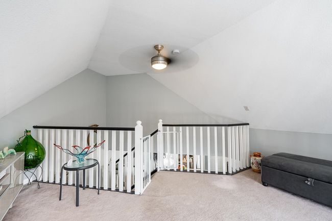 Bonus room featuring carpet floors, ceiling fan, and vaulted ceiling | Image 26