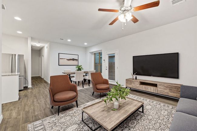 Living room with light wood-type flooring, visible vents, a ceiling fan, recessed lighting, and baseboards | Image 5