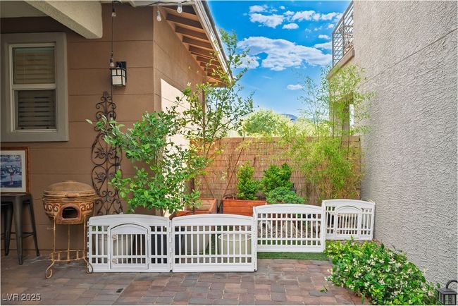 View of home's exterior featuring a patio and fence | Image 36