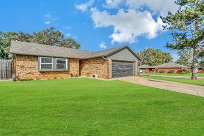 Front ot the home with two car attached garage. | Image 2