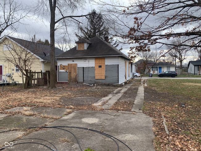 view of front of house featuring a chimney | Image 5