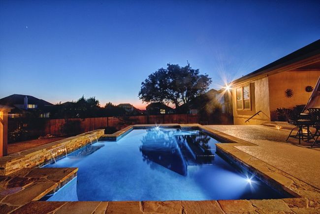 Backyard Oasis with Sparkling Pool, Pergola, and Outdoor Kitchen | Image 38
