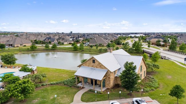 Aerial perspective of suburban area featuring a nearby body of water | Image 24