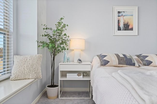 Carpeted bedroom with baseboards | Image 33