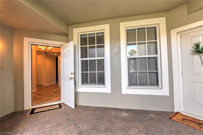 Entrance to property featuring stucco siding | Image 8