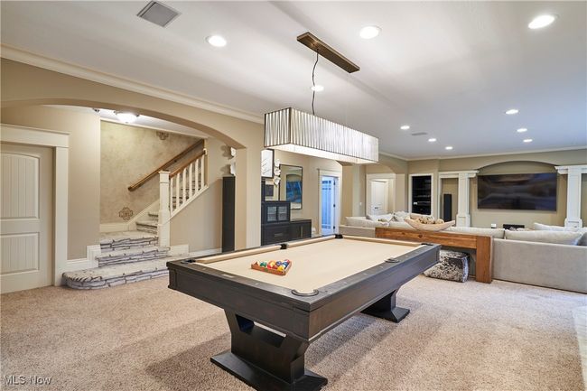 The steps from upstairs open into great space in the lower level | Image 33