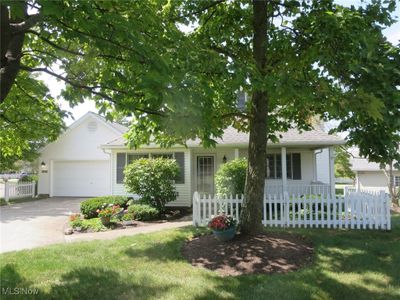 House with a front yard and a garage | Image 3