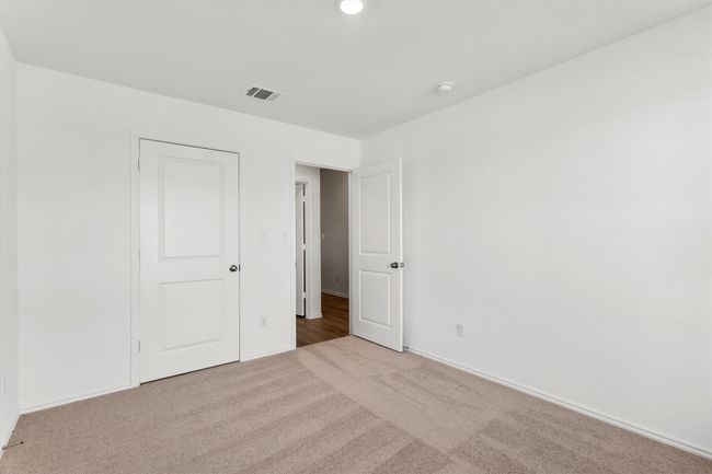 Unfurnished bedroom featuring carpet and baseboards | Image 19