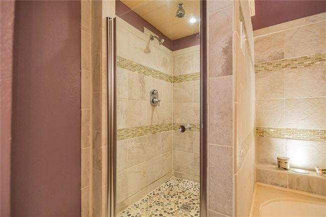 Full bathroom featuring a shower stall | Image 19