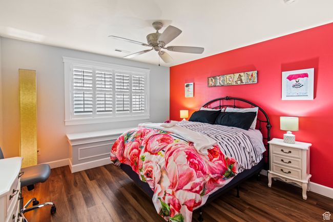 Bedroom featuring ceiling fan and dark hardwood / wood-style flooring | Image 65