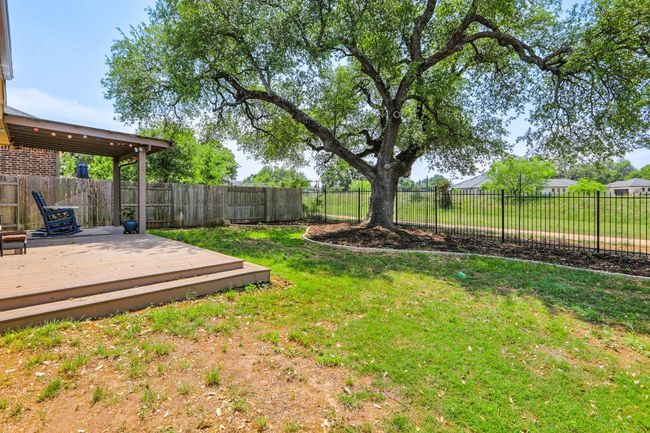View of yard with a wooden deck and a fenced backyard | Image 31