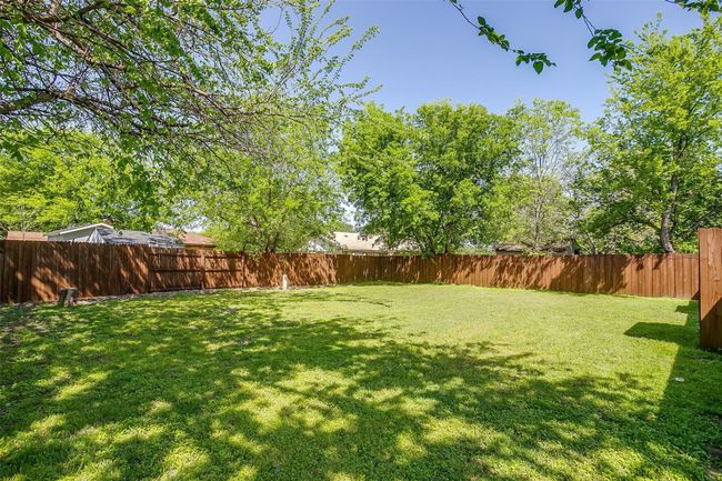 View of fenced backyard | Image 30