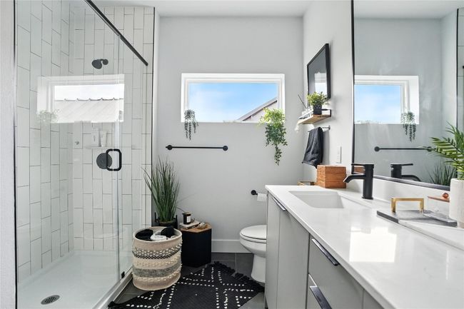 Full bathroom featuring healthy amount of natural light, vanity, and a shower stall | Image 9