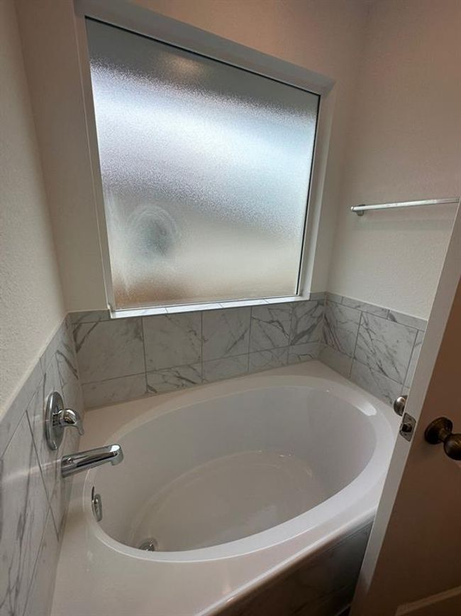Bathroom with a bath | Image 23