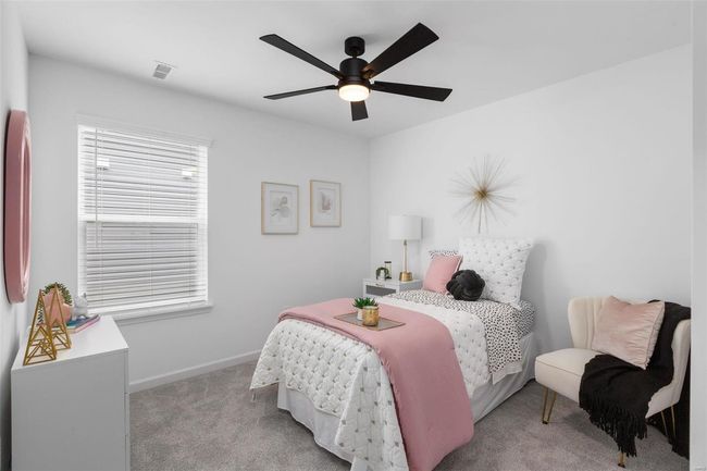 Bedroom featuring ceiling fan and light carpet | Image 23