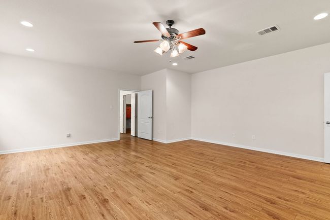 Spare room featuring visible vents, baseboards, ceiling fan, recessed lighting, and light wood-style flooring | Image 23
