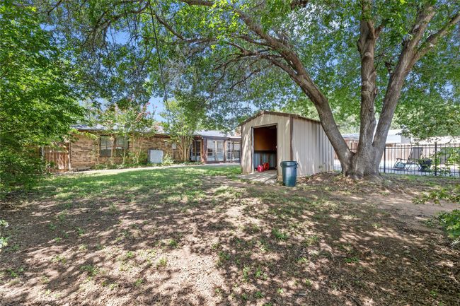 Backyard with storage building | Image 38