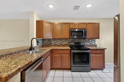 7033 Woodmont Way, Tamarac, FL, 33321-2655 | Card Image