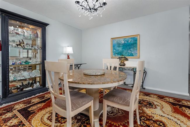 Dining space featuring a chandelier | Image 17