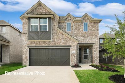 View of front of house featuring a garage | Image 1