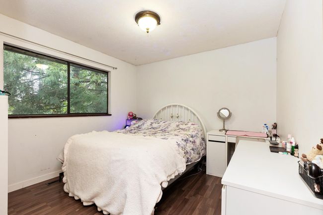 Bedroom with dark wood-style floors | Image 22