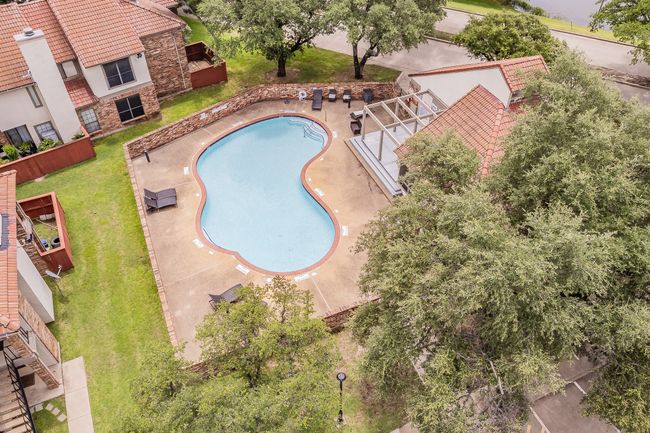 View of pool with a lawn and a patio | Image 28