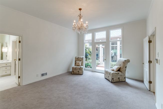 Sitting room featuring carpet floors, a chandelier, and baseboards | Image 14