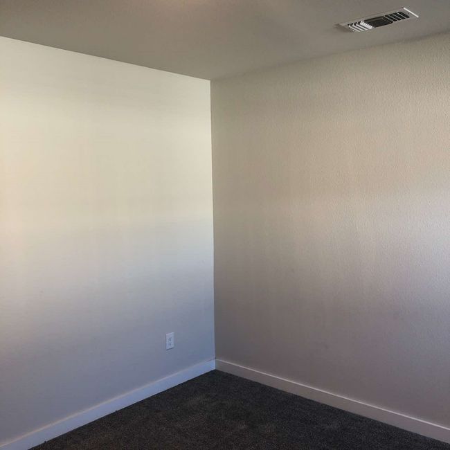 Empty room with dark colored carpet and baseboards | Image 12