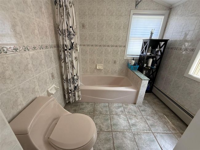 Large Second Floor Bathroom featuring neutral Ceramic tile | Image 16